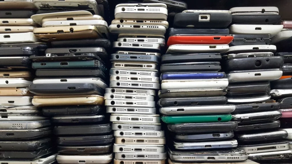 A stack of various old smartphones, showcasing a creative way to repurpose outdated devices.